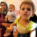 Syrian refugees families await treatment at a medical center at the Al Zaatri refugee camp in Mafraq, Jordan, June 11. At the end of his weekly general audience June 19, Pope Francis called attention to World Refugee Day, focusing particularly on the pli ght of refugee families.
