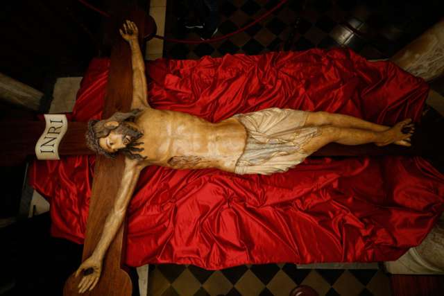 A wooden crucifix from the 14th century is pictured during a media opportunity to showcase its restoration in St. Peter&#039;s Basilica at the Vatican Oct. 28. The crucifix is one of the few items that was present in the original St. Peter&#039;s Basilica. The restoration was funded by the Knights of Columbus.