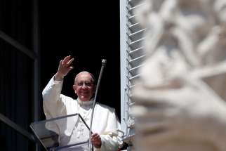 Pope Francis waves as he arrives to lead the Regina Coeli ion St. Peter&#039;s Square at the Vatican May 14.