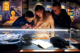 Visitors to the Juno Beach Centre examine an exhibit.