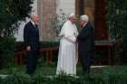 Pope Francis greets Palestinian President Mahmoud Abbas as Israeli President Shimon Peres looks on during an invocation for peace in the Vatican Gardens June 8, 2014.