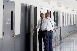 A correctional officer shows U.S. President Barack Obama a cell during a visit to El Reno Federal Correctional Institution outside Oklahoma City July 16. Obama is the first sitting president to visit a federal prison.