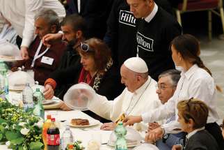  Pope Francis eats lunch with poor people as he marks World Day of the Poor at the Vatican Nov. 18. Some 1,500 people joined the Pope for lunch in Paul VI hall. 