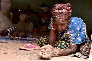 An elderly displaced Christian woman rests in a church in Kaya, Burkina Faso, May 16, 2019. Bishops&#039; conferences from Francophone West Africa have pledged solidarity with Christian communities after a spate of Islamist attacks. 