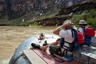 A couple takes a guided rafting trip inside the Grand Canyon in Arizona Sept. 14, 2014. 