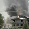 This video image made from DRTV shows a cloud of smoke rising into the sky as blasts rocked Brazzaville, the capital of the Republic of Congo Sunday March 4, 2012 after a weapons depot caught fire. One of the buildings that collapsed was St. Louis Catholic Church.