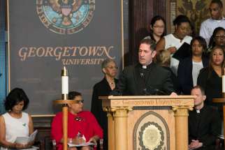 Jesuit Father Timothy Kesicki, president of the Jesuit Conference of Canada and the United States, delivers the homily at an April 18 &quot;Liturgy of Remembrance, Contrition and Hope&quot; in Gaston Hall on the campus of Georgetown University in Washington.