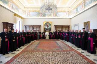Pope Francis poses for a photo with Australian bishops during their &quot;ad limina&quot; visits to the Vatican June 24, 2019. The bishops traveled to Rome to report on the status of their dioceses.