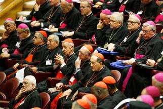 Cardinals and bishops attend the opening session of the Synod of Bishops on young people, the faith and vocational discernment at the Vatican Oct 3.