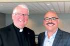 Rocco Gizzarelli, the retiring executive director of Hamilton’s Catholic Children’s Aid, right, with Hamilton Bishop Douglas Crosby.