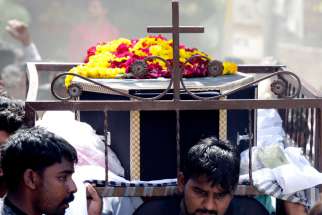 People carry the coffin of a suicide bomb victim in Lahore, Pakistan, March 28. A landmark declaration by the third global conference on the world’s religion, which rejects fanaticism and terrorism, was adopted in Montreal Sept. 14. 