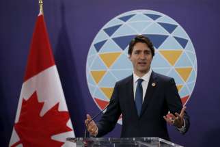 Canadian Prime Minister Justin Trudeau gestures as he speaks during a news conference after attending the 21-member Asia-Pacific Economic Cooperation (APEC) summit in Manila, Philippines, Nov. 19.