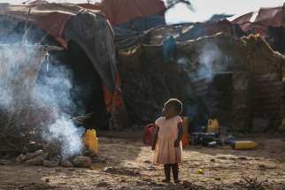 A young internally displaced child walks outside makeshift shelters in late March at a camp on the outskirts of Qardho, Somalia. Bishop Giorgio Bertin of Djibouti urged the international community to focus on alleviating the drought in Somalia as 6 million people experience severe foods shortages and contend with the al-Shabab extremist group.
