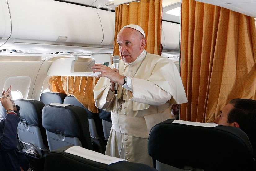 Pope Francis speaks to journalists aboard his flight from Rome to Krakow, Poland, July 27. The Pope is attending World Youth Day in Krakow.