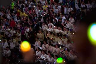 People hold electric candles during the closing ceremony of a meeting with families, led by Pope Francis at the Mall of Asia Arena in Pasay City, Philippines, Jan. 16.