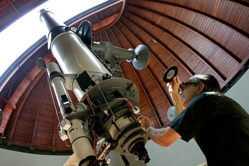The Rev. Emmanuel Carreira operates the telescope at the Vatican Observatory in Castel Gandolfo, south of Rome, on June 23, 2005. The Vatican Observatory, one of the world&#039;s oldest astronomical institutes, selects young, promising scholars for courses at the papal summer palace.