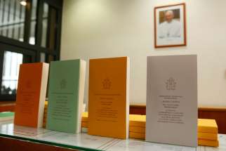 Copies of Pope Francis&#039; apostolic exhortation on the family, &quot;Amoris Laetitia&quot; (&quot;The Joy of Love&quot;), are seen during the document&#039;s release at the Vatican April 8. The exhortation is the concluding document of the 2014 and 2015 synods of bishops on the family.