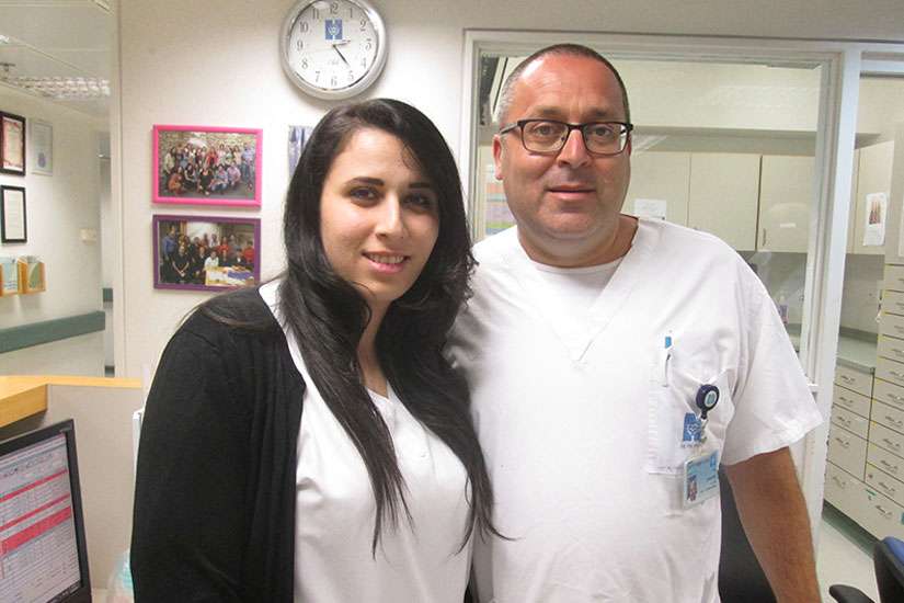 Rula Badarna, left, and Stuart Levy, both nurses at Hadassah Medical Center in Jerusalem, say their ward is a model of religious coexistence and friendship.