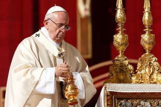 Pope Francis uses incense as he celebrates the canonization Mass of new saints in St. Peter&#039;s Square at the Vatican Oct. 15. The pope canonized groups of martyrs from Mexico and Brazil, an Italian Capuchin priest and a Spanish priest.