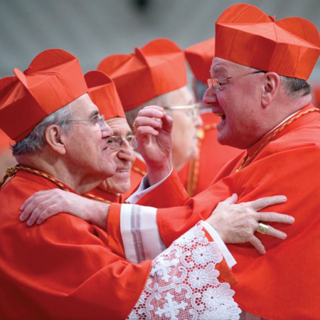 Mexican Cardinal Javier Lozano Barragan, retired president of the Pontifical Council for Health Care Ministry, congratulates U.S. Cardinal Timothy Dolan of New York during a consistory in St. Peter&#039;s Basilica at the Vatican Feb. 18.