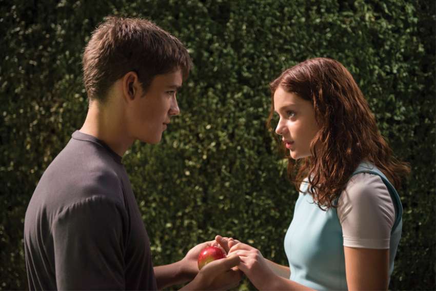 Brenton Thwaites and Odeya Rush star in a scene from the 2014 movie The Giver, in which governing forces keep the population in line through “preciseness of speech.”