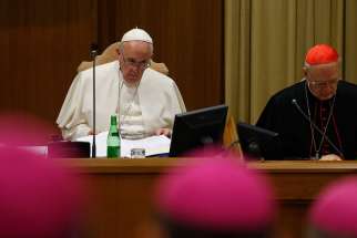 Pope Francis participates in prayer at the start of a session of the Synod of Bishops on the family at the Vatican Oct. 23. 