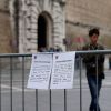 A notice announcing the closure of the Sistine Chapel is displayed outside the Vatican Museums in Rome March 6. The Sistine Chapel will remain closed to the public from March 5 for the papal conclave.