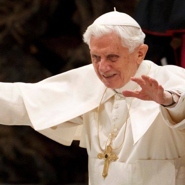 Pope Benedict XVI greets the crowd during his general audience in Paul VI hall at the Vatican Dec. 28.