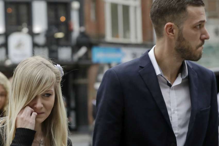 The parents of critically ill baby Charlie Gard, Connie Yates and Chris Gard arrive at the High Court in London, Monday, July 24, 2017