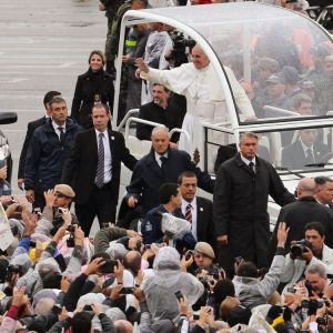 Pope Francis greets pilgrims as he arrives at Brazil&#039;s Basilica of the National Shrine of Our Lady of Aparecida July 24. During his visit, the pope entrusted World Youth Day to Mary&#039;s maternal protection, but also challenged parents, priests and other ad ult Catholics to give the young people things that the world, with all its wealth, cannot: faith and values.