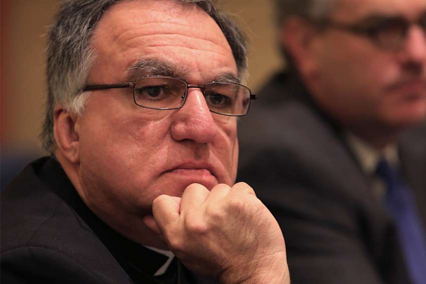 Basilian Father Thomas Rosica, CEO of Canada&#039;s Salt and Light Media Foundation, listens to a speaker Nov. 10, 2014, during the annual fall general assembly of the U.S. Conference of Catholic Bishops in Baltimore.