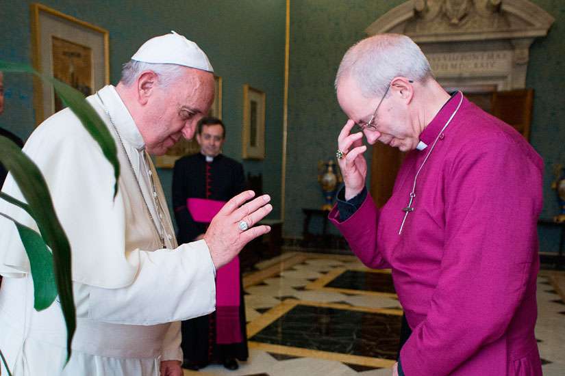 Pope Francis blesses Anglican Archbishop Justin Welby of Canterbury, spiritual leader of the Anglican Communion, during a private meeting at the Vatican June 16, 2014