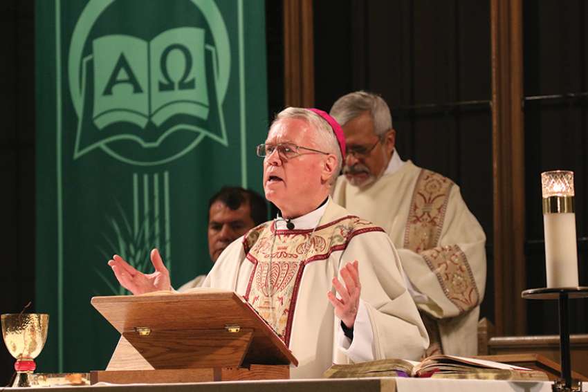 In this 2015 file photo, New York Auxiliary Bishop John J. Jenik celebrates Mass at St. John-Visitation Church in the Kingsbridge section of the Bronx borough of New York. He has been removed from public ministry pending a Vatican review of a decades-old accusation of sexual abuse against him, a claim he denies, the Archdiocese of New York said in a letter released Oct. 31. 