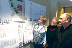 Architects have drawn up plans for building additions and improvements at Holy Rosary Parish in Guelph. Here, from left, are parishioners Maria Gazzola and Barbara Smith and Fr. Vernon Boyd, S.J., pastor of Holy Rosary.