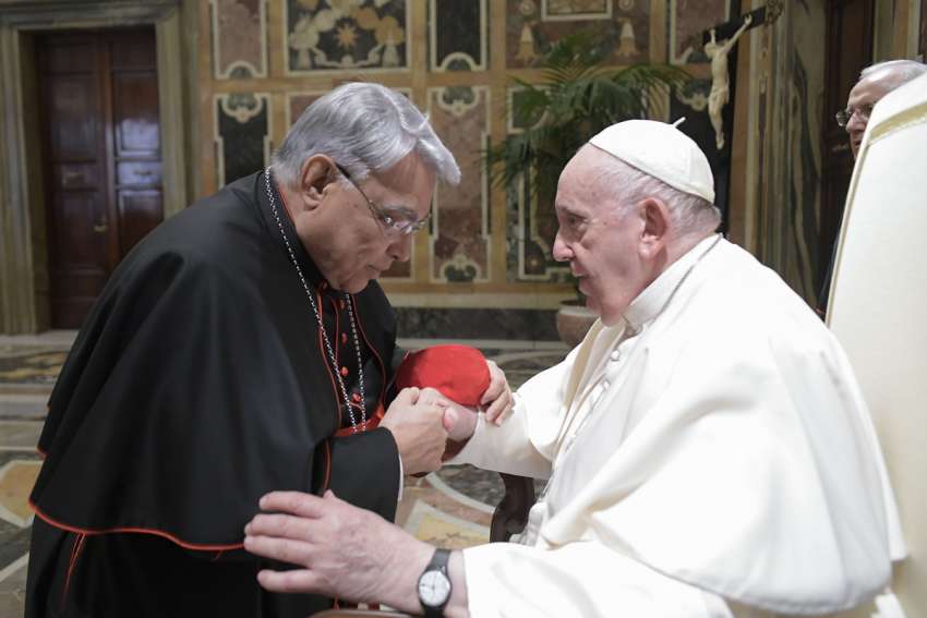 Pope Francis greets Cardinal Marcello Semeraro, prefect of the Dicastery for the Causes of Saints, during an audience with the participants of a symposium on &quot;Holiness Today,&quot; sponsored by the Dicastery for the Causes of Saints, at the Vatican Oct. 6, 2022.