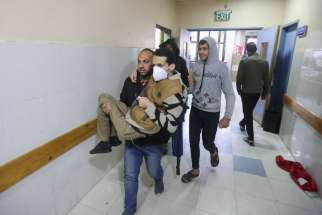 A Palestinian is carried into Nasser Hospital Jan. 22, 2024, in Khan Younis in the southern Gaza Strip who was wounded in an Israeli airstrike, amid the ongoing conflict between Israel and the Palestinian Islamist group Hamas.