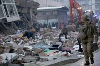 People search for survivors under the rubble following an earthquake in Diyarbakir, Turkey, Feb. 6, 2023. A powerful 7.8 magnitude earthquake rocked areas of Turkey and Syria early that morning, toppling hundreds of buildings and killing more than 1,500 people.