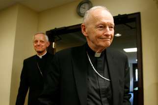 Then-Cardinal Theodore E. McCarrick of Washington and then-Archbishop Donald W. Wuerl leave a 2006 news conference after the archbishop was introduced as the new head of the Washington Archdiocese.