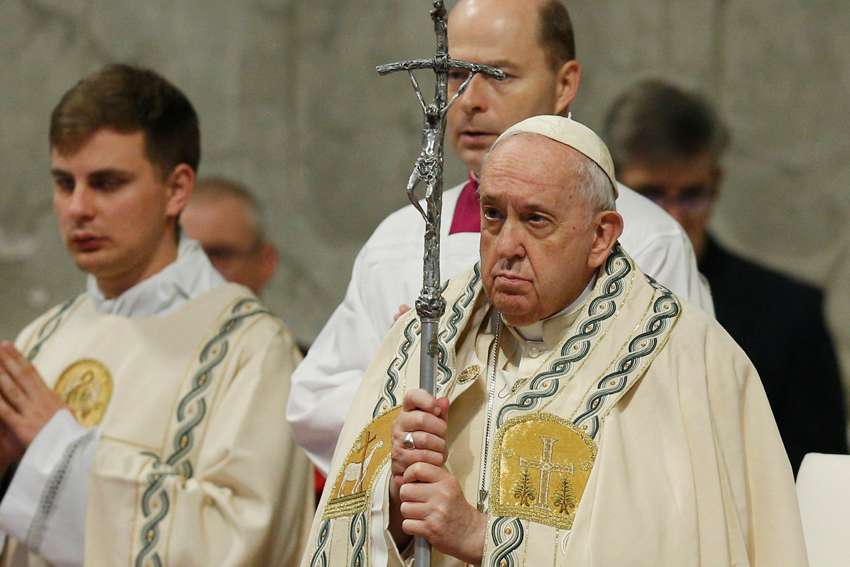 Pope Francis holds his crosier as he celebrates Mass on the feast of Mary, Mother of God, in St. Peter&#039;s Basilica at the Vatican Jan. 1, 2023.