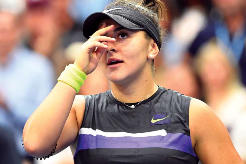 Bianca Andreescu makes the sign of the cross after beating Serena Williams in the final of the U.S. Open tennis championship Sept. 7 at Arthur Ashe Stadium in Flushing, N.Y. The 19-year-old Andreescu became the first Canadian ever to win a Grand Slam singles title.