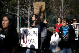 Recipients and supporters of the Deferred Action for Childhood Arrivals program protest Jan. 22 outside Disneyland in Anaheim, Calif. 