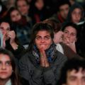 A young woman reacts as she and others watch a televised broadcast of the inaugural Mass of the pontiff on a giant screen outside of the Metropolitan Cathedral in Buenos Aires, Argentina, March 19.