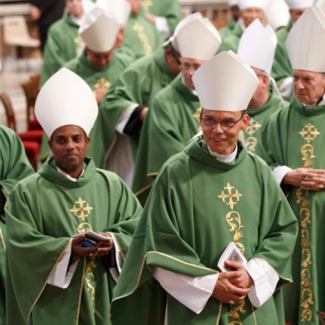 Bishops leave in procession after attending the closing Mass of the Synod of Bishops on the new evangelization celebrated by Pope Benedict XVI in St. Peter&#039;s Basilica at the Vatican Oct. 28.