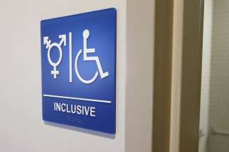 A gender-neutral bathroom is seen in this Sept. 30, 2014, file photo.