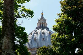 The dome of St. Peter&#039;s Basilica at the Vatican is framed by trees June 14, 2018. In the aftermath of the Notre Dame Cathedral fire in Paris, Maj. Paolo De Angelis, head of the Vatican fire department, told the Italian news agency ANSA April 16 that the structural differences between Notre Dame and Peter&#039;s make a catastrophic fire less likely. 