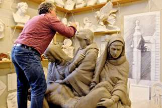 Lawrence Voaides works on the Pietà that will be placed above the Loretto sisters’ crypt.
