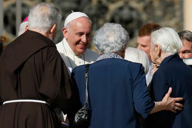 Pope Francis greets people during an encounter with the elderly in St. Peter&#039;s Square at the Vatican Sept. 28. 