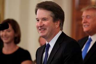 Brett Kavanaugh, a Catholic, who is a judge on the U.S. Court of Appeals for the District of Columbia Circuit, smiles July 9 at the White House in Washington after President Donald Trump named him his Supreme Court nominee. 