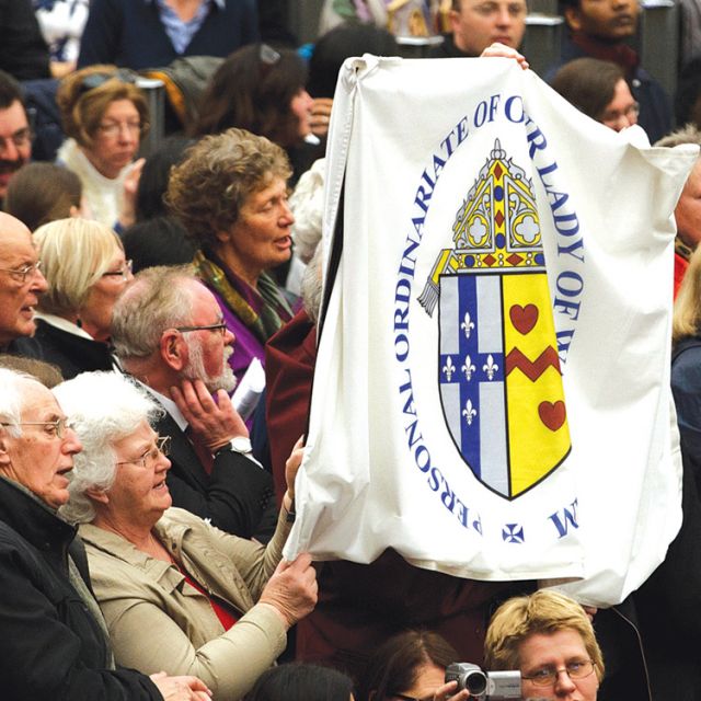 Members of the Personal Ordinariate of Our Lady of Walsingham in England attend Pope Benedict XVI’s general audience in Paul VI hall at the Vatican Feb. 22. About 90 former Anglicans who entered the Catholic Church and are now members of the ordinariate attended the audience.