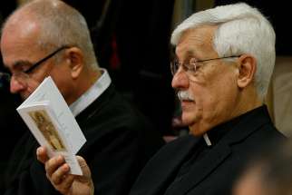  Father Arturo Sosa Abascal, superior general of the Society of Jesus, prays at the start of a session of the Synod of Bishops on young people, the faith and vocational discernment at the Vatican Oct. 11. 